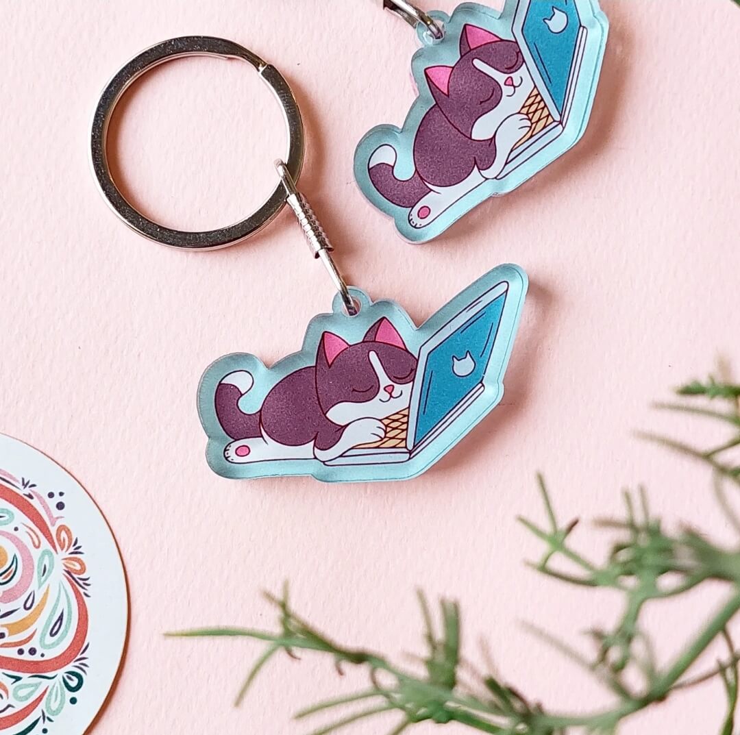 Sleeping cat on laptop Acrylic Keychain